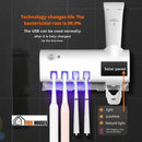 Toothbrush Sterilizer UV - SmartBrush - Color: White. installed in a gray wall. With the written message: Technology changes life The bactericidal rate is 99.9%; The USB can be used normally after it is fully charged for the first time; solar panel; Vibe Houses