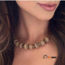 Necklace Earlth Terra Gold Statement, a woman is wearing the wonderful necklace around her neck. vibehouses