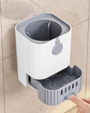 Toilet brush with long handle and drain base. Image of a bathroom showing a drain base installed on the wall; vibe houses