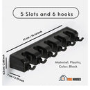 Broom holder. Multifunctional. 5 Slots and 6 hooks; Length: 41cm/16.14inch; Height: 6.3 cm / 2.48 Inch; Width: 7 cm / 2.75 Inch; Material: Plastic; Color: Black; order now; vibe houses