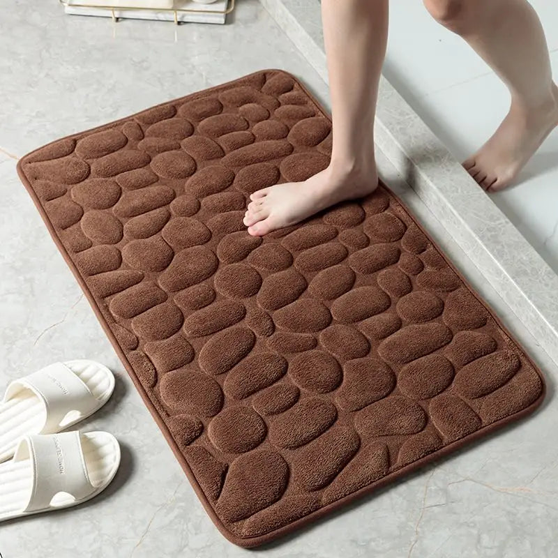 Bare feet step on the brown absorbent mat when leaving the bath, beautiful and safe. Vibe Houses