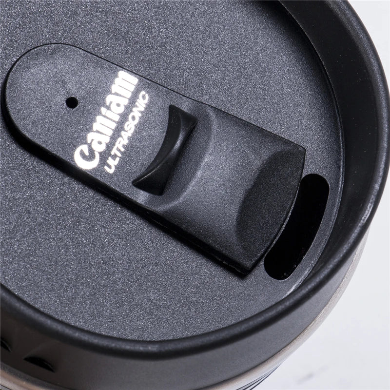Mug; Zoom shows details of the lid written CANIAM ULTRASONIC. Vibe houses