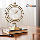 Hourglass Sand Nordic Retro Decoration - 30 Minutes. It's on top of a book that's on the table; vibe houses