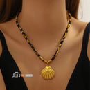 Ocean Shell Necklace. Enlarged image, woman wears ocean shell necklace around her neck, vibe houses
