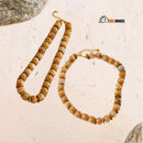 Necklace | Terra Gold - Brown coffee color. Two piece of the necklace is on display. Enlarged image; vibe houses