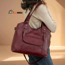 Margaret - Shoulder or handbag in soft leather - woman is holding the bag on her shoulder; vibe houses