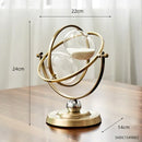 Hourglass Nordic Sand Retro Decoration - 30 Minutes. It is on a wooden table and highlights the measurements of the product; 24cm, 22cm, 14cm; vibe houses