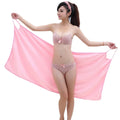 Bath towel with wearable handle for women; The model is standing and wearing a pink towel; Order Now! Vibe houses