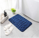 Bare feet step on the blue absorbent mat when leaving the bath, beautiful and safe. Vibe Houses