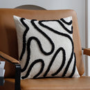 Cushion cover; in black, decorating a chair; order now; vibe houses