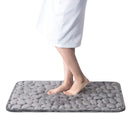 Bare feet step on the gray absorbent mat when leaving the bath, beautiful and safe. Vibe Houses