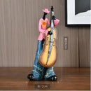 Picture with Cello-Ron: 28 * 12 cm. On a table near the wall. On the wall there is a picture; order now; Vibe Houses; 49406448173368