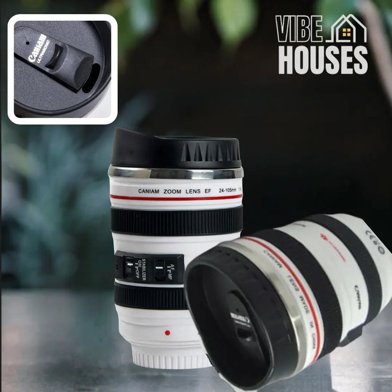 Natural landscape in the background. Two stainless steel mug with camera lens. White color! At the top of the right side detail of the lid. Vibe Houses