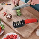 Scissors and knife sharpener - image with the sharpener on a wooden board; A person is cutting a cucumber with a sharpened knife; Vibe Houses