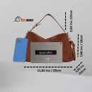 Bag Solea - Brown, Dimensions: 11.81 × 7.48 × 3.93 inches; - 29 x 19 x 10 cm. For size reference, it is placed next to an iPad and a cell phone, Vibe houses