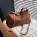 Solea bag - Brown, placed next to a window, vibe houses