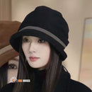 Luxury corduroy bucket hat from Vell. Elegance and comfort. Limited seasonal collection. Woman wears a Black fisherman's hat on her head; vibe houses