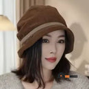 Luxury corduroy bucket hat from Vell. Elegance and comfort. Limited seasonal collection. Woman wears a coffee fisherman's hat on her head; vibe houses