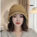bucket hat for winter. Woman wearing the hat. Khaki color; vibe houses