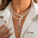Necklace | Long pearl necklace with crystal pendants. Woman wears necklace around her neck, vibe houses