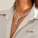 Pearl necklace with crystal pendant - Lunna. The woman is wearing it around her neck. The photo is enlarged vibe houses