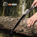 Saw. Carbon fiber folding. Being used to cut a tree trunk. SwiftCarve by Vibe Houses