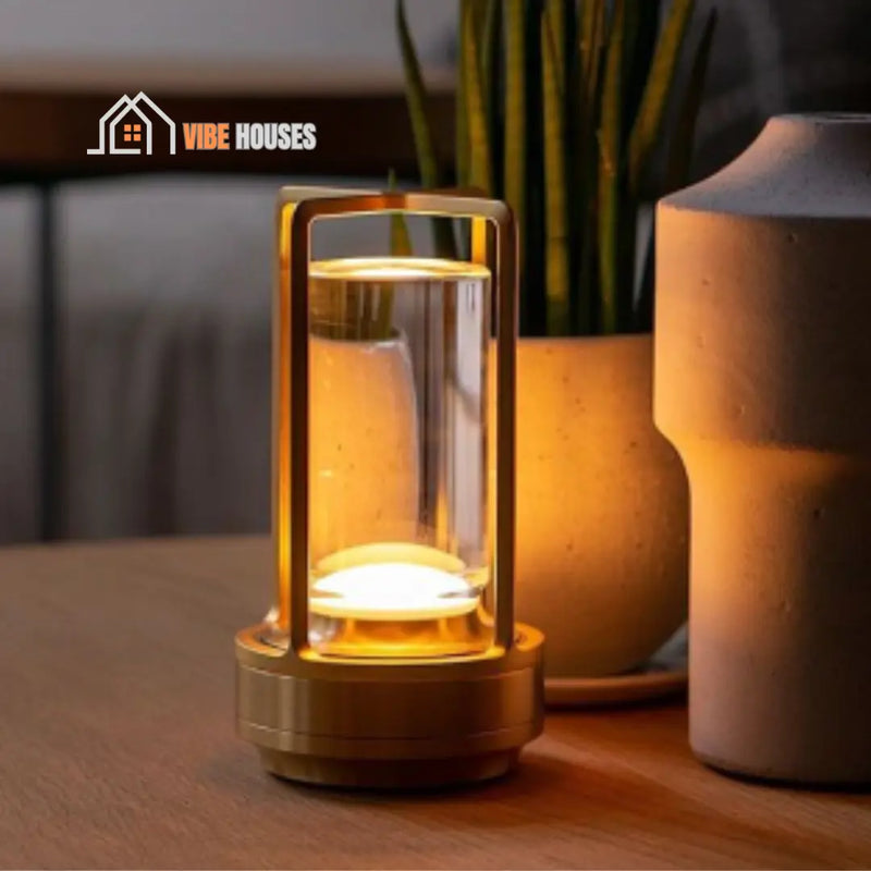 Table Lamp. Touch LED - This is next to a vase and a plant pot all on a table. Vibe Houses